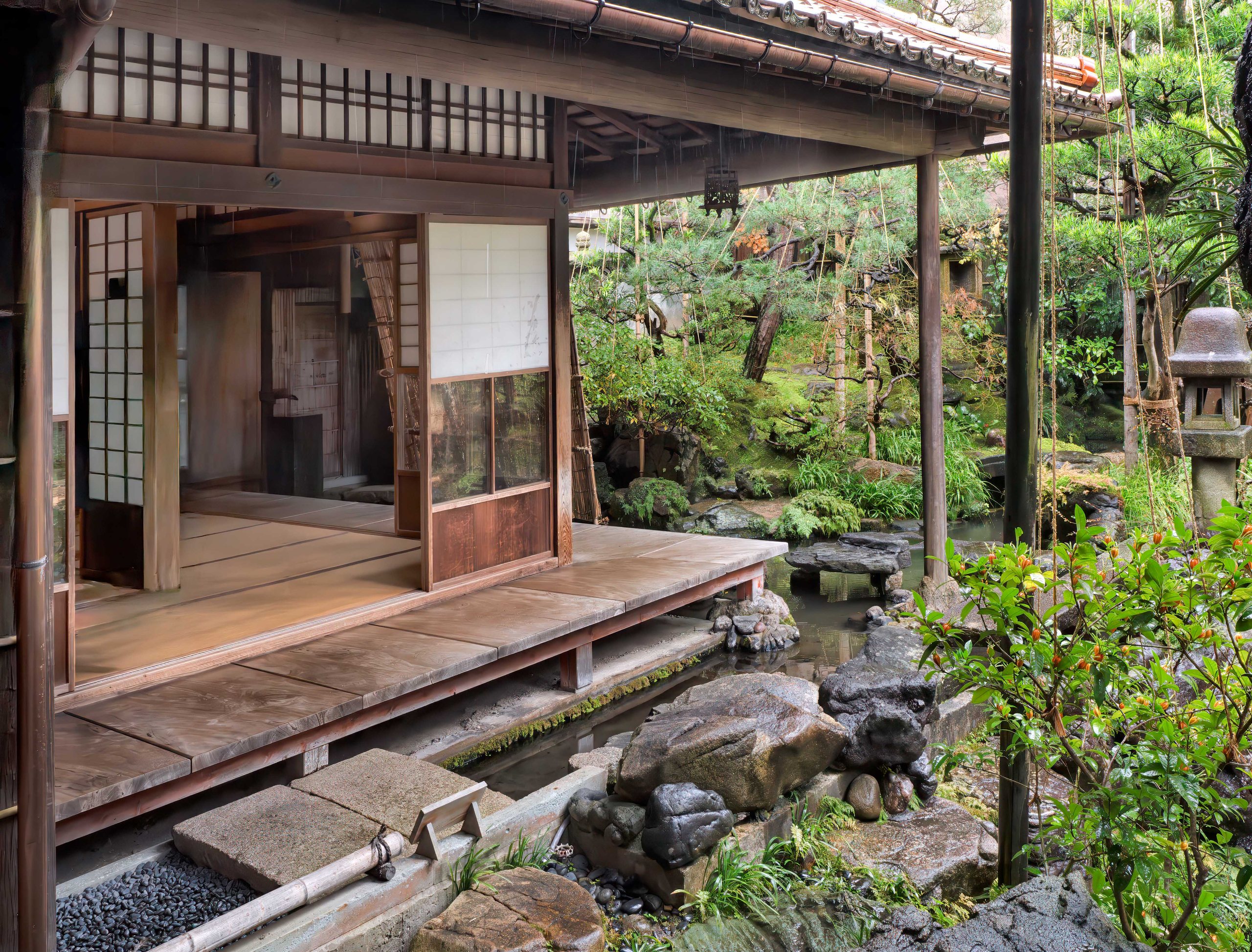 The wooden veranda of the Nomura samurai house above its moss and stone garden, Kanazawa