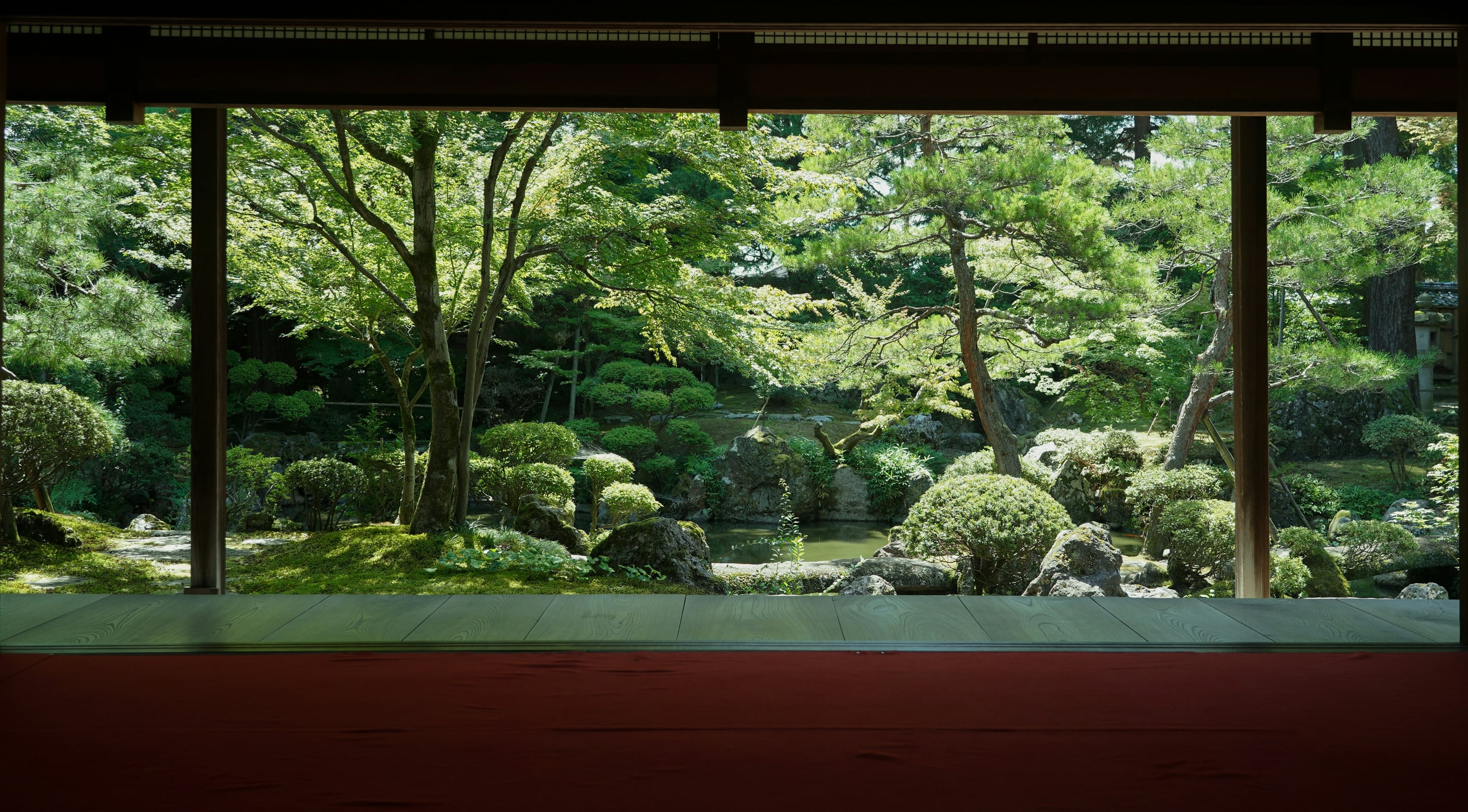 An old Japanese room opened full width onto its summer garden