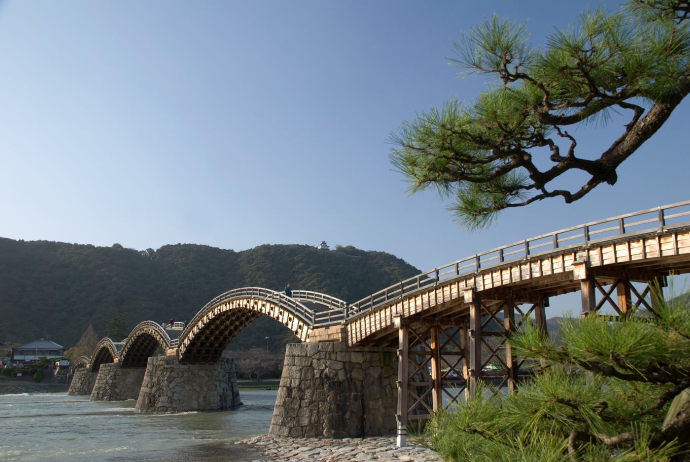 The five wooden arches of the Kintai Bridge spanning the river