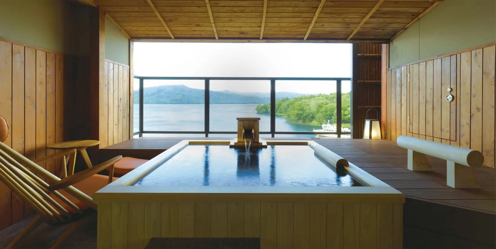 A cypress bath at Hinanoza, open across Lake Akan
